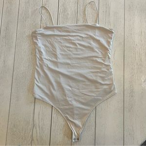 Beige spaghetti strap/cami bodysuit